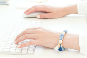 Hands on keyboard typing website copy